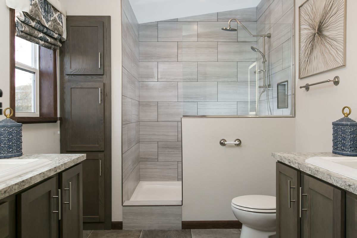 The INDEPENDENCE 29 Primary Bathroom. This Manufactured Mobile Home features 4 bedrooms and 2 baths.