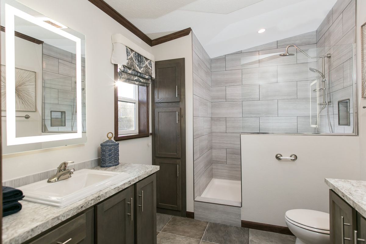 The INDEPENDENCE 29 Primary Bathroom. This Manufactured Mobile Home features 4 bedrooms and 2 baths.