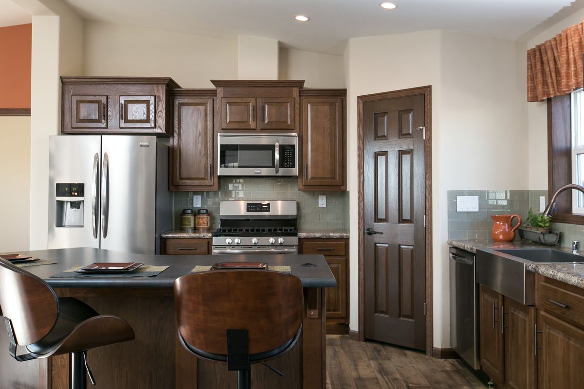 The INTEGRITY 98 MOD Kitchen. This Manufactured Mobile Home features 2 bedrooms and 2 baths.