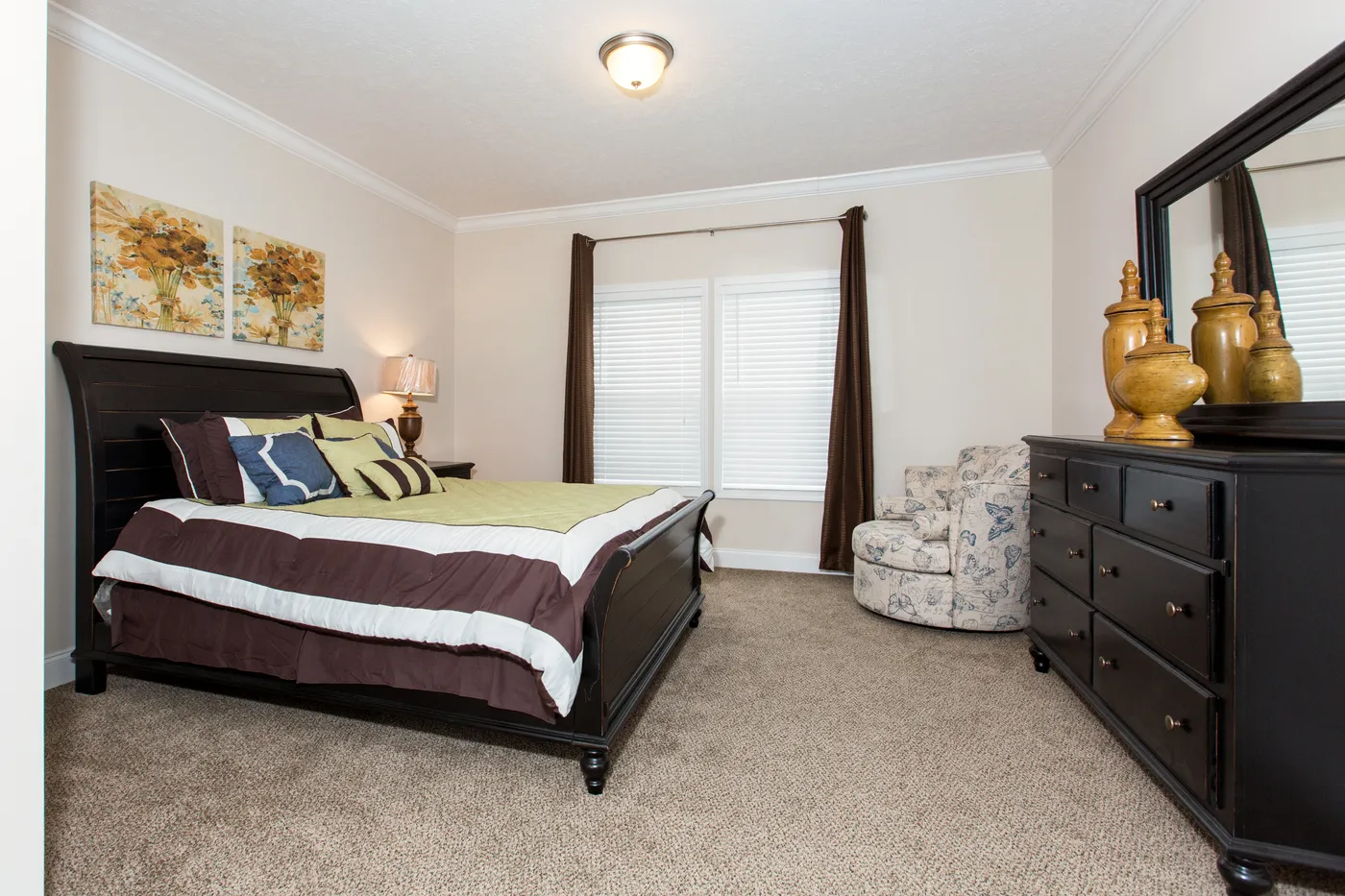 The J533 MOD Primary Bedroom. This Manufactured Mobile Home features 3 bedrooms and 2 baths.