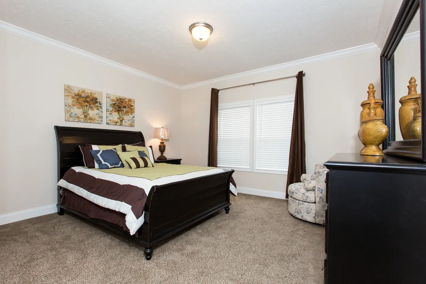 The J533 MOD Primary Bedroom. This Manufactured Mobile Home features 3 bedrooms and 2 baths.