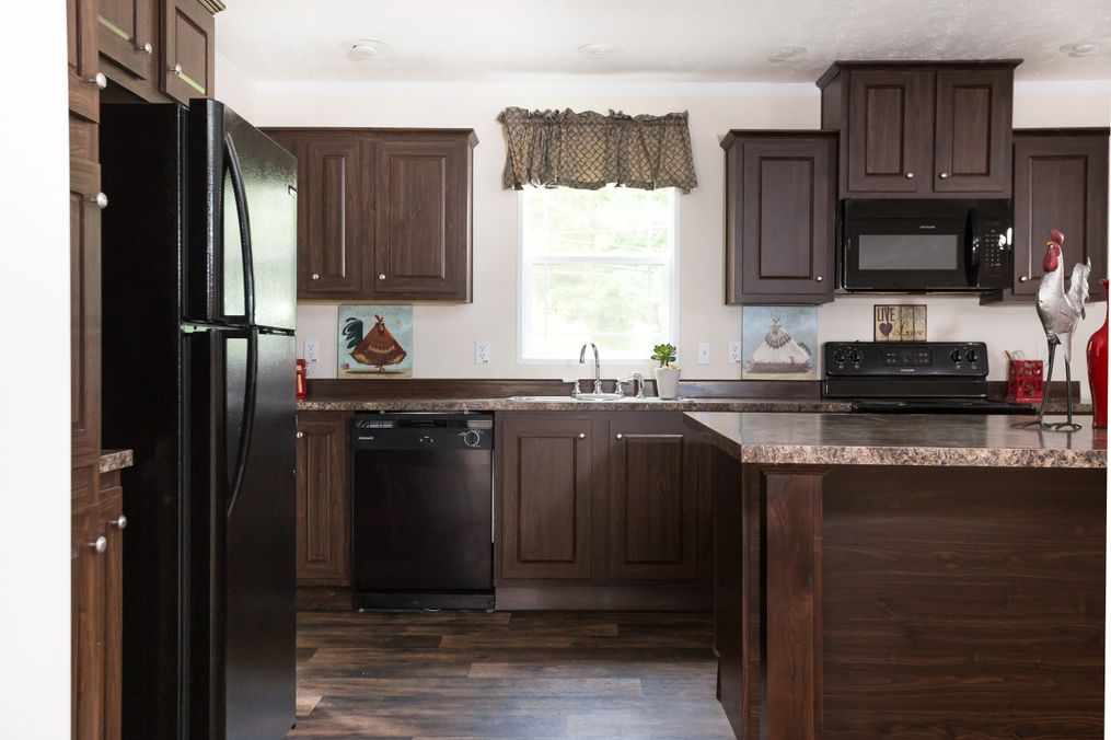 The RANGER 56B Kitchen. This Manufactured Mobile Home features 3 bedrooms and 2 baths.