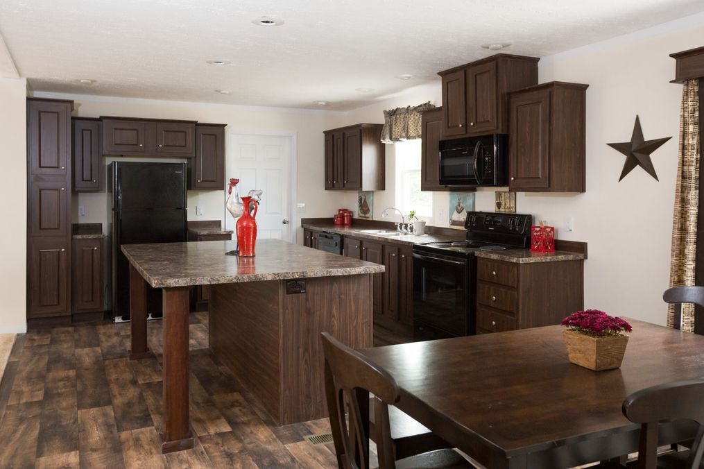 The RANGER 56B Kitchen. This Manufactured Mobile Home features 3 bedrooms and 2 baths.