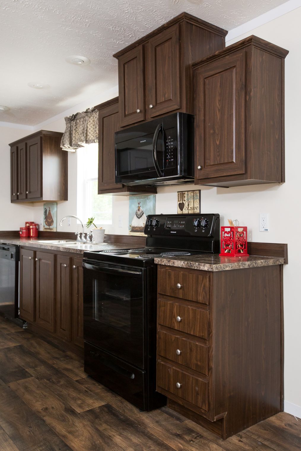 The RANGER 56B Kitchen. This Manufactured Mobile Home features 3 bedrooms and 2 baths.