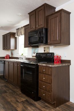 The RANGER 56B Kitchen. This Manufactured Mobile Home features 3 bedrooms and 2 baths.
