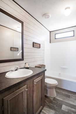 The SIG28483B Guest Bathroom. This Manufactured Mobile Home features 3 bedrooms and 2 baths.
