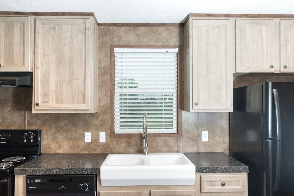 The THE ANNIVERSARY 18 4 BR Kitchen. This Manufactured Mobile Home features 4 bedrooms and 2 baths.