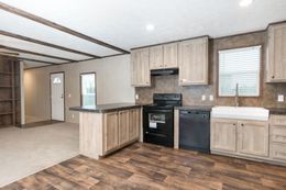 The THE ANNIVERSARY 18 4 BR Kitchen. This Manufactured Mobile Home features 4 bedrooms and 2 baths.
