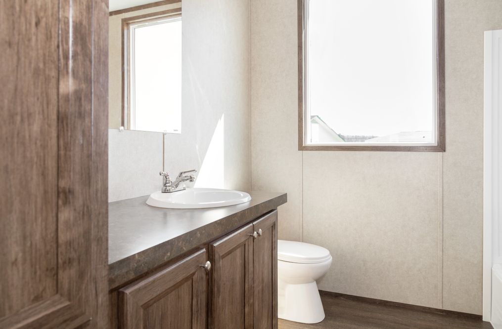 The THE ANNIVERSARY 2.0 Guest Bathroom. This Manufactured Mobile Home features 3 bedrooms and 2 baths.