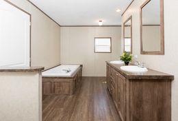 The THE ANNIVERSARY 2.0 Primary Bathroom. This Manufactured Mobile Home features 3 bedrooms and 2 baths.