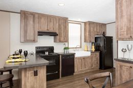 The THE ANNIVERSARY Kitchen. This Manufactured Mobile Home features 3 bedrooms and 2 baths.