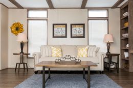 The THE ANNIVERSARY Living Room. This Manufactured Mobile Home features 3 bedrooms and 2 baths.