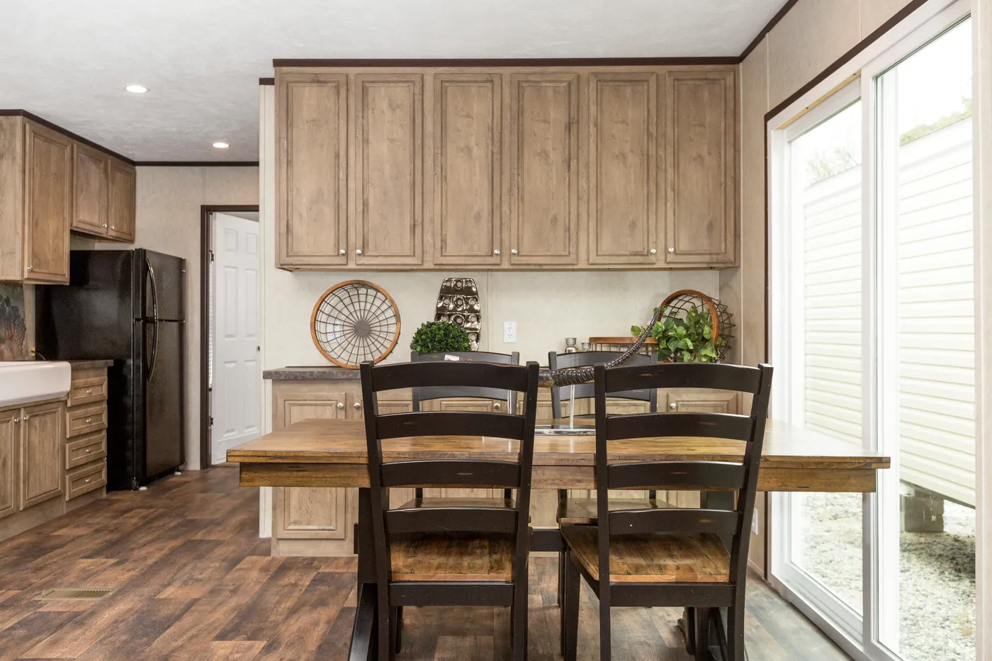 The THE ANNIVERSARY ANN16864A Dining Area. This Manufactured Mobile Home features 4 bedrooms and 2 baths.