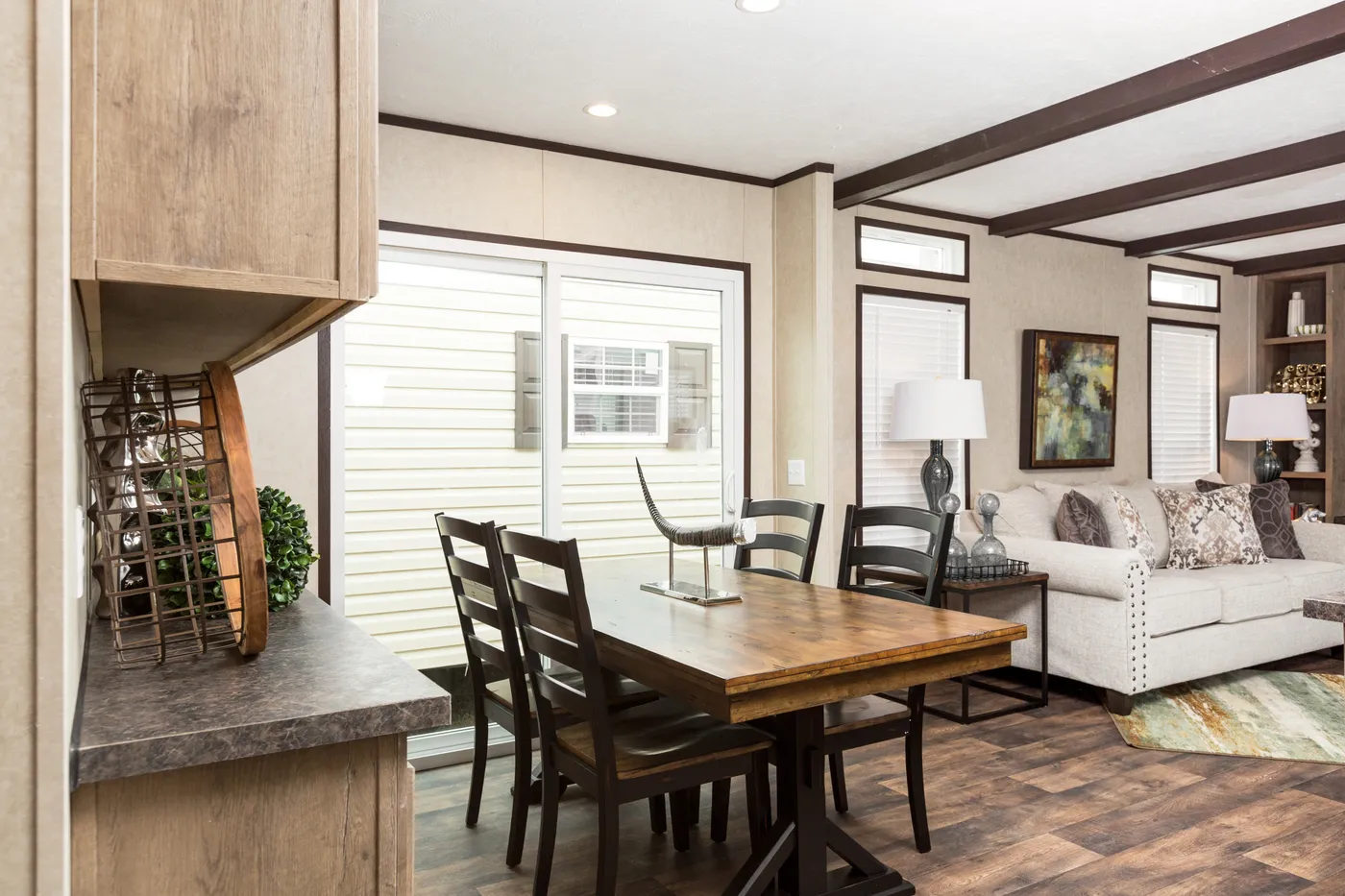 The THE ANNIVERSARY ANN16864A Dining Area. This Manufactured Mobile Home features 4 bedrooms and 2 baths.