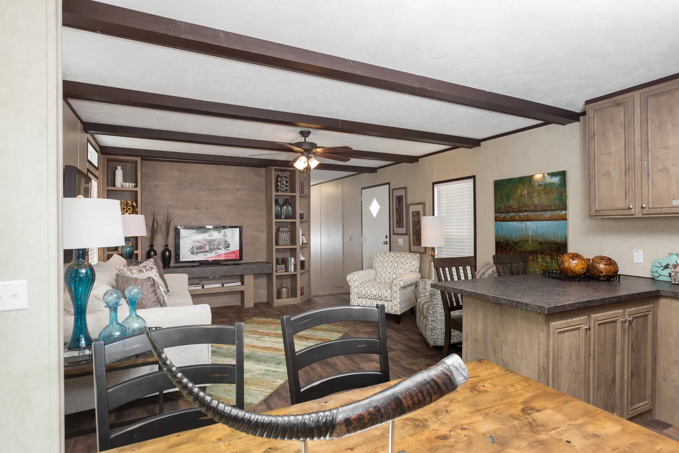 The THE ANNIVERSARY ANN16864A Dining Area. This Manufactured Mobile Home features 4 bedrooms and 2 baths.