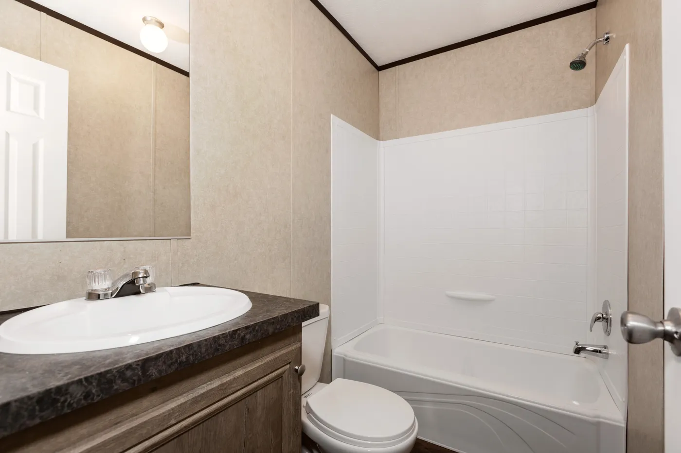 The THE ANNIVERSARY ANN16864A Guest Bathroom. This Manufactured Mobile Home features 4 bedrooms and 2 baths.