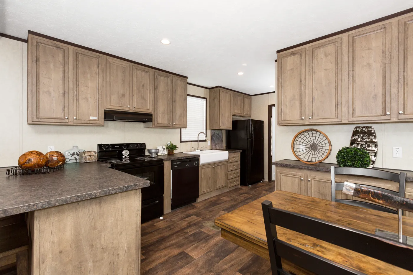 The THE ANNIVERSARY ANN16864A Kitchen. This Manufactured Mobile Home features 4 bedrooms and 2 baths.
