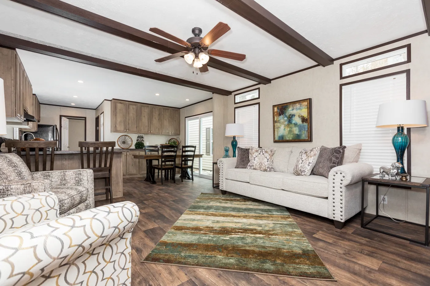 The THE ANNIVERSARY ANN16864A Living Room. This Manufactured Mobile Home features 4 bedrooms and 2 baths.