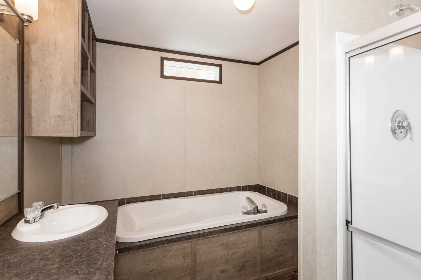 The THE ANNIVERSARY ANN16864A Primary Bathroom. This Manufactured Mobile Home features 4 bedrooms and 2 baths.