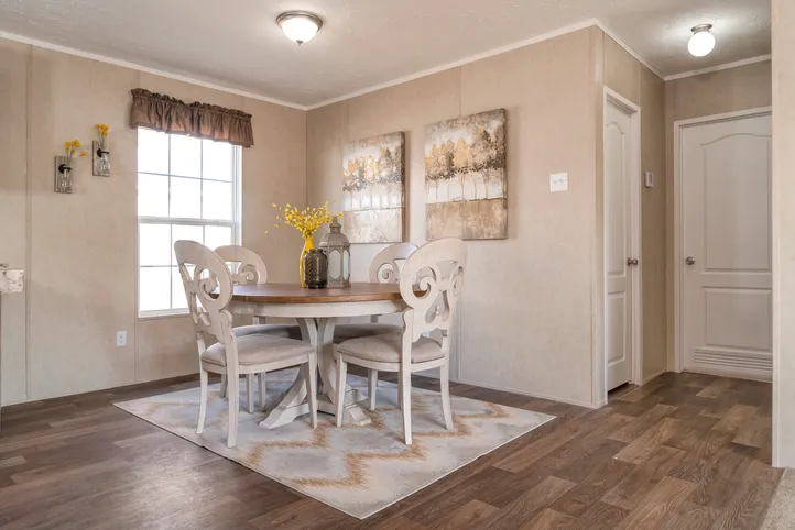 The THE EAGLE 52 Dining Area. This Manufactured Mobile Home features 3 bedrooms and 2 baths.