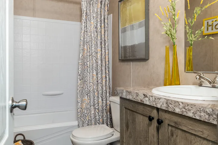 The THE EAGLE 52 Guest Bathroom. This Manufactured Mobile Home features 3 bedrooms and 2 baths.