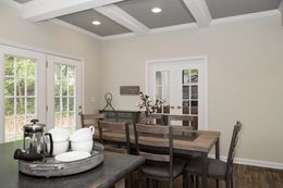 The THE KENNESAW Dining Area. This Manufactured Mobile Home features 4 bedrooms and 2 baths.