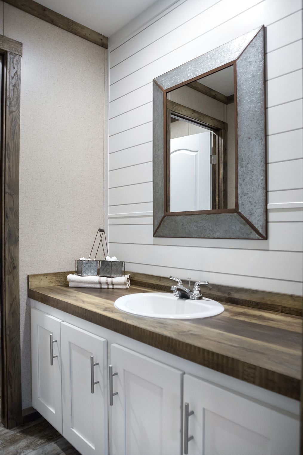 The THE LITTLEFIELD Guest Bathroom. This Manufactured Mobile Home features 3 bedrooms and 2 baths.