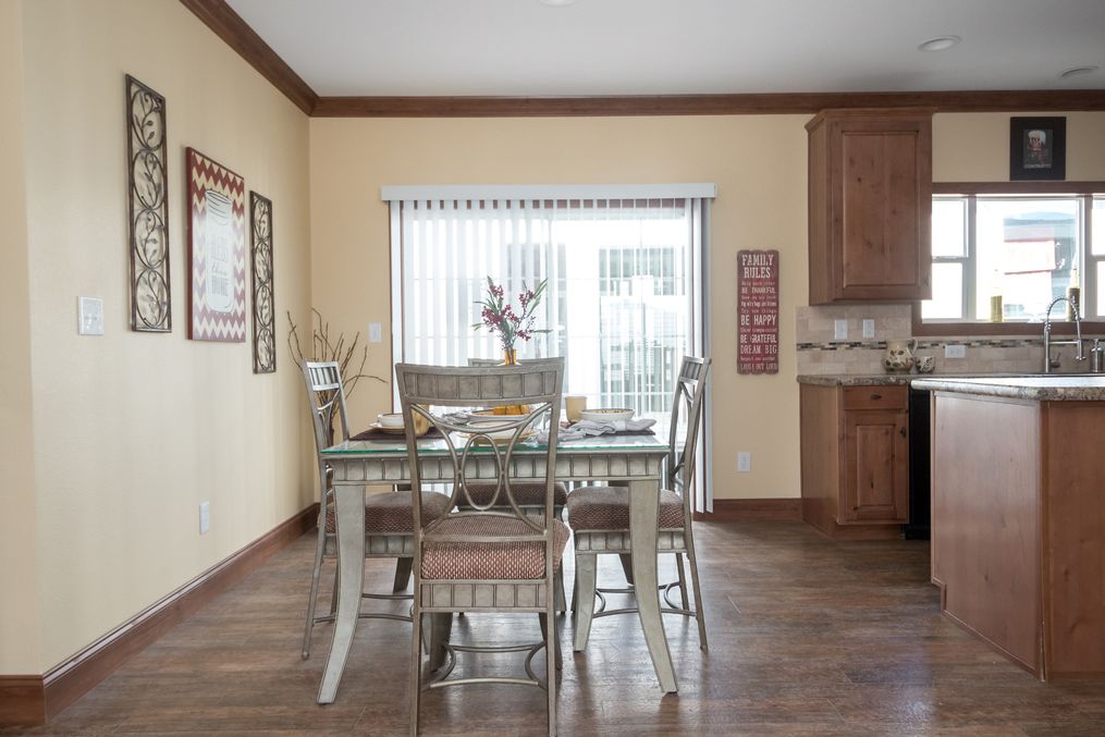 The THE OHIO Dining Area. This Manufactured Mobile Home features 4 bedrooms and 2 baths.