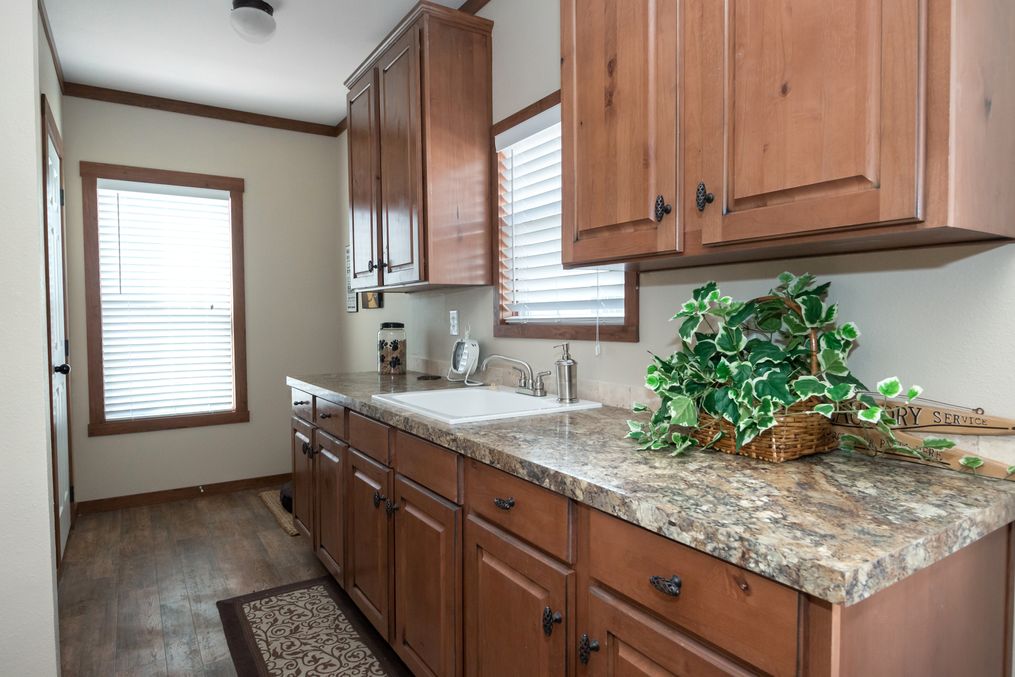 The THE OHIO Utility Room. This Manufactured Mobile Home features 4 bedrooms and 2 baths.