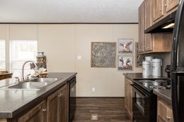 The THE SOLUTION Kitchen. This Manufactured Mobile Home features 3 bedrooms and 2 baths.