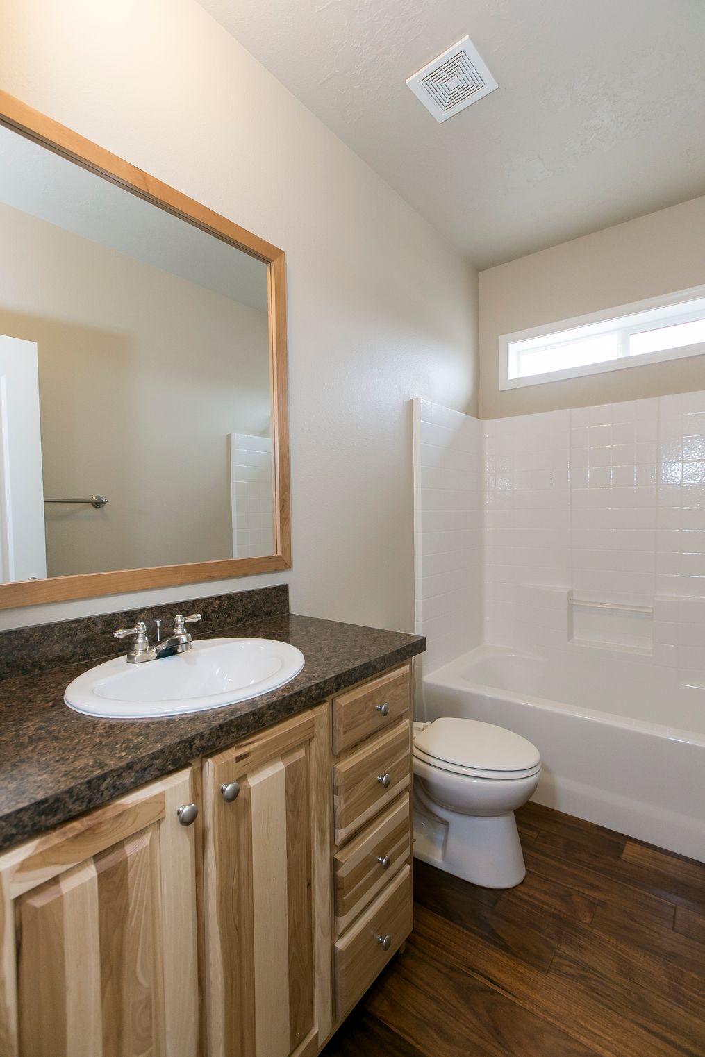 The THE SPRUCE Guest Bathroom. This Manufactured Mobile Home features 3 bedrooms and 2 baths.