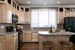 The THE SPRUCE Kitchen. This Manufactured Mobile Home features 3 bedrooms and 2 baths.