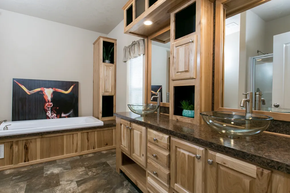 The THE SPRUCE Primary Bathroom. This Manufactured Mobile Home features 3 bedrooms and 2 baths.