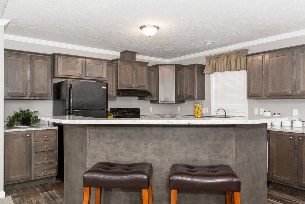 The TUCSON Kitchen. This Manufactured Mobile Home features 3 bedrooms and 2 baths.