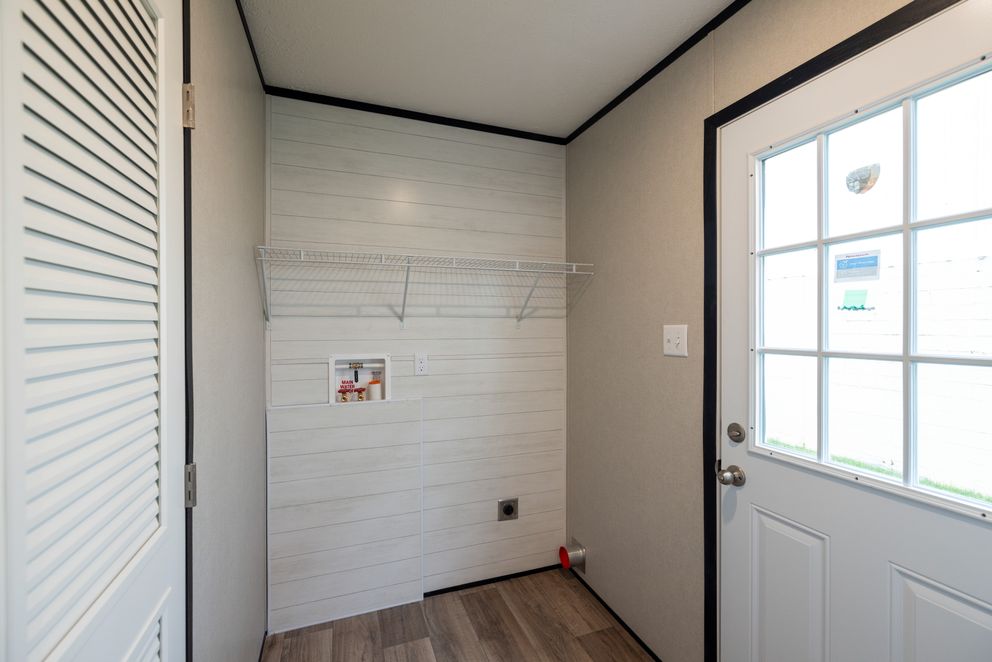 The PLATINUM ANNIVERSARY Exterior. This Manufactured Mobile Home features 3 bedrooms and 2 baths.