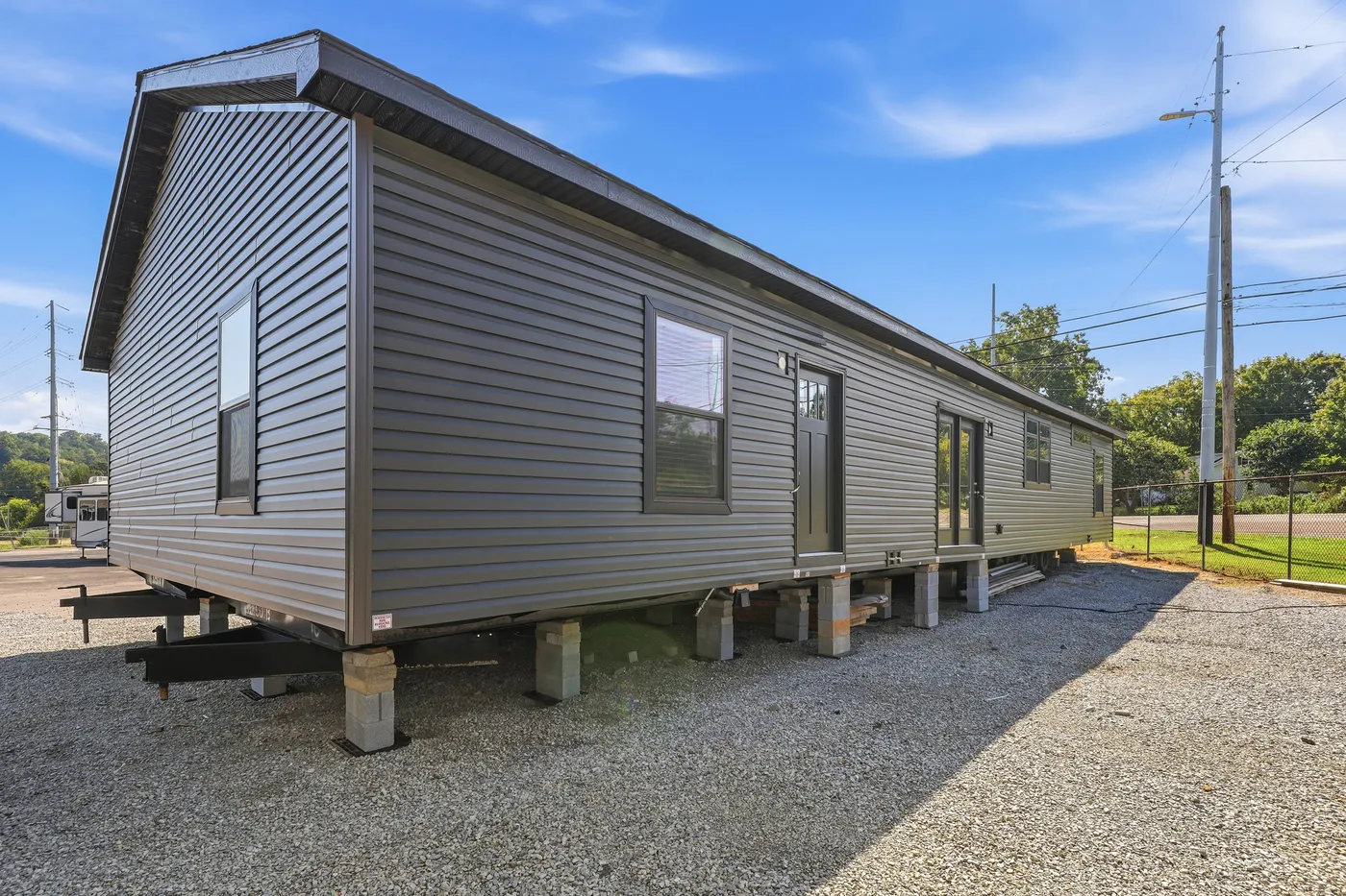 The SUPER 68 ELITE Exterior. This Manufactured Mobile Home features 3 bedrooms and 2 baths.