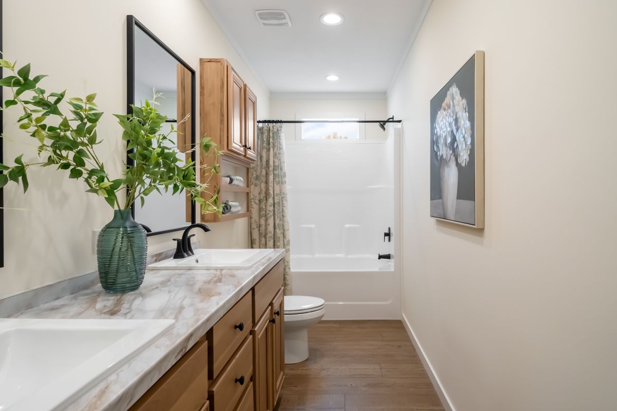 The THE ROCKING CHAIR Exterior. This Manufactured Mobile Home features 3 bedrooms and 2 baths.