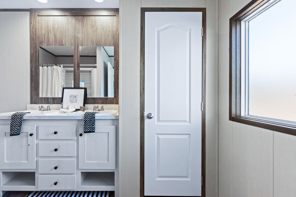 The ANNIVERSARY 16763F Primary Bathroom. This Manufactured Mobile Home features 3 bedrooms and 2 baths.