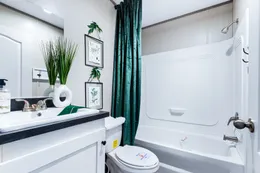The ANNIVERSARY 16763I Guest Bathroom. This Manufactured Mobile Home features 3 bedrooms and 2 baths.
