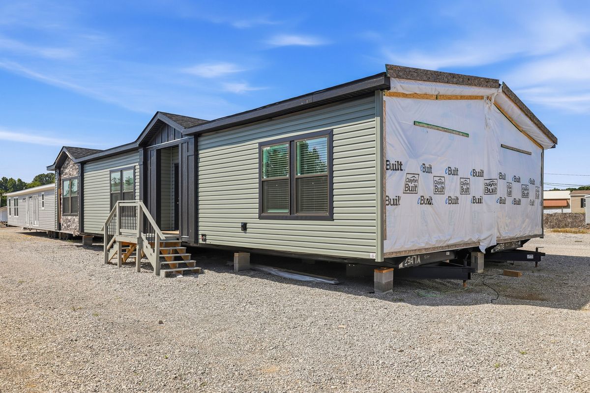 The THE FREEDOM GRAND 4BR 32X62 Exterior. This Manufactured Mobile Home features 4 bedrooms and 2 baths.