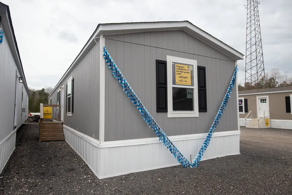 The COLOSSAL Exterior. This Manufactured Mobile Home features 3 bedrooms and 2 baths.