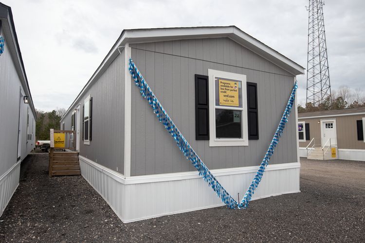 The COLOSSAL Exterior. This Manufactured Mobile Home features 3 bedrooms and 2 baths.