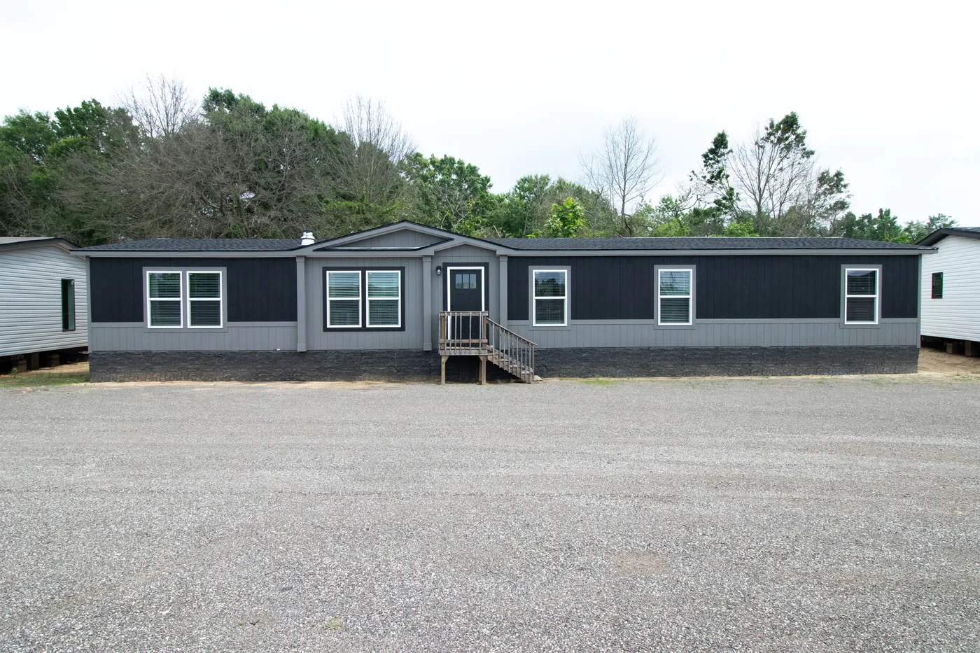 The ABSOLUTE VALUE Exterior. This Manufactured Mobile Home features 4 bedrooms and 2 baths.