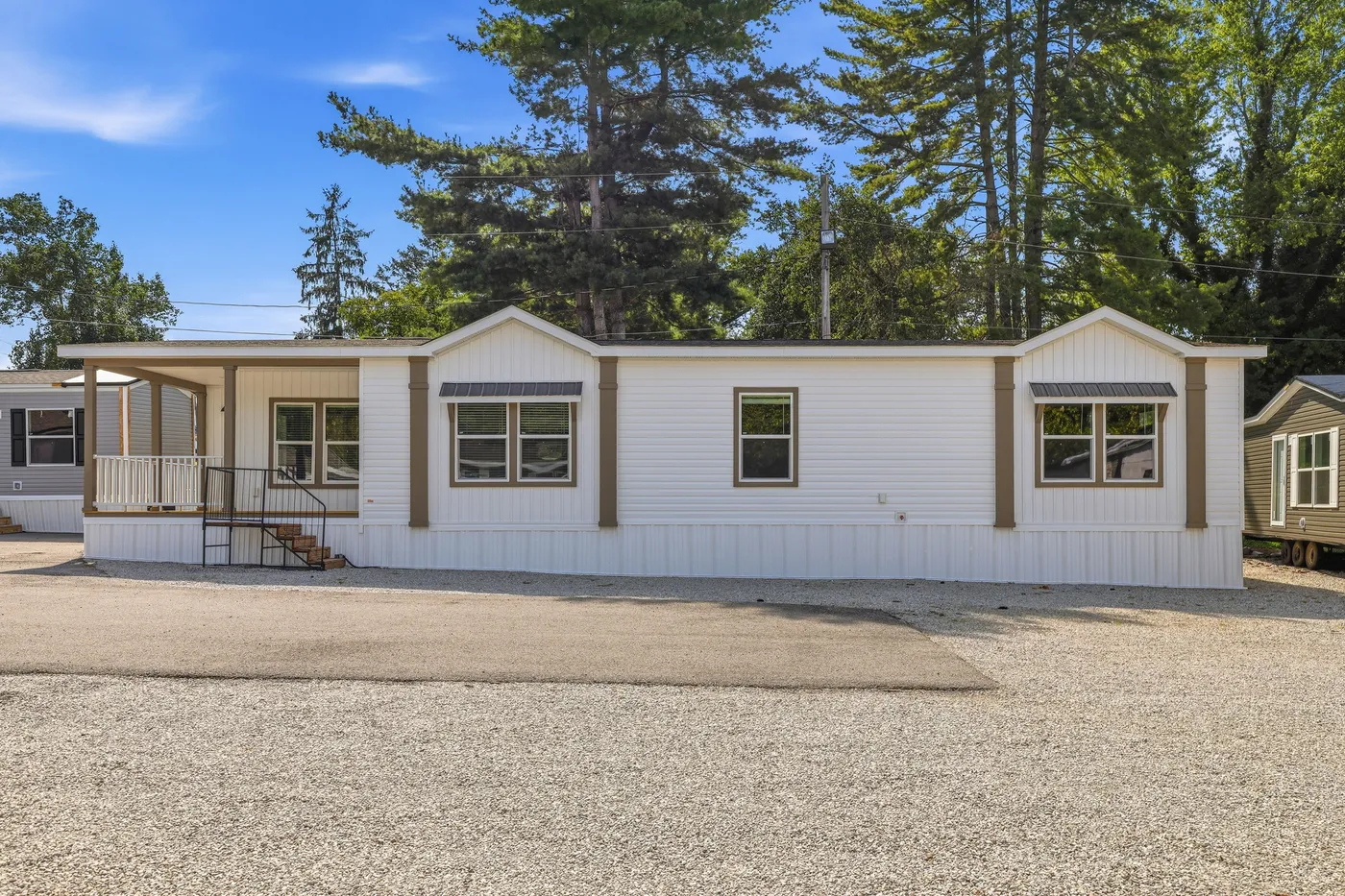 The SOUTHERN CHARM Exterior. This Manufactured Mobile Home features 3 bedrooms and 2 baths.
