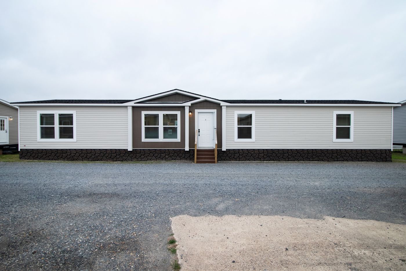 The THE CHOICE Exterior. This Manufactured Mobile Home features 4 bedrooms and 2 baths.
