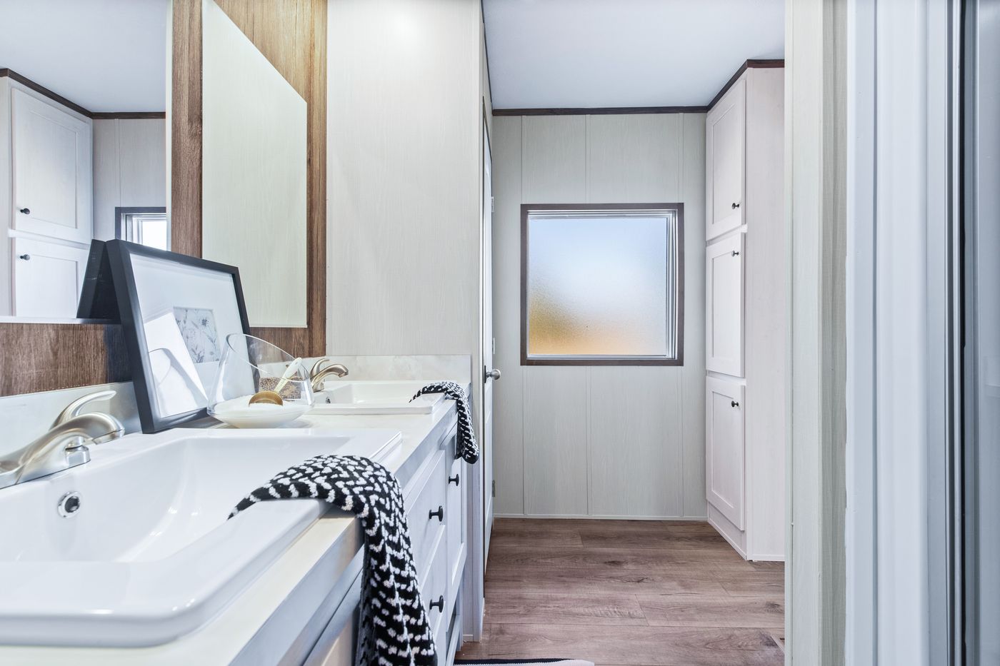 The ANNIVERSARY 16763F Primary Bathroom. This Manufactured Mobile Home features 3 bedrooms and 2 baths.