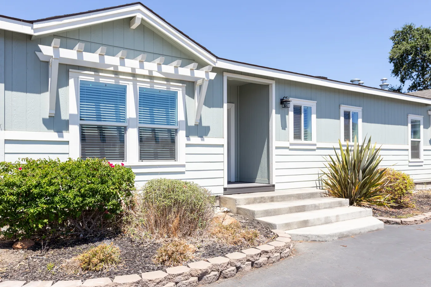 The CORONADO 24563C Trellis Exterior. This Manufactured Mobile Home features 3 bedrooms and 2 baths.