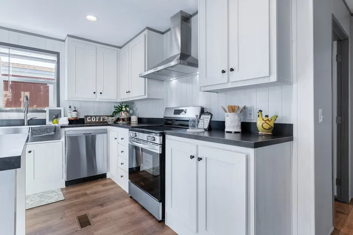 The ANNIVERSARY 16763I Kitchen. This Manufactured Mobile Home features 3 bedrooms and 2 baths.