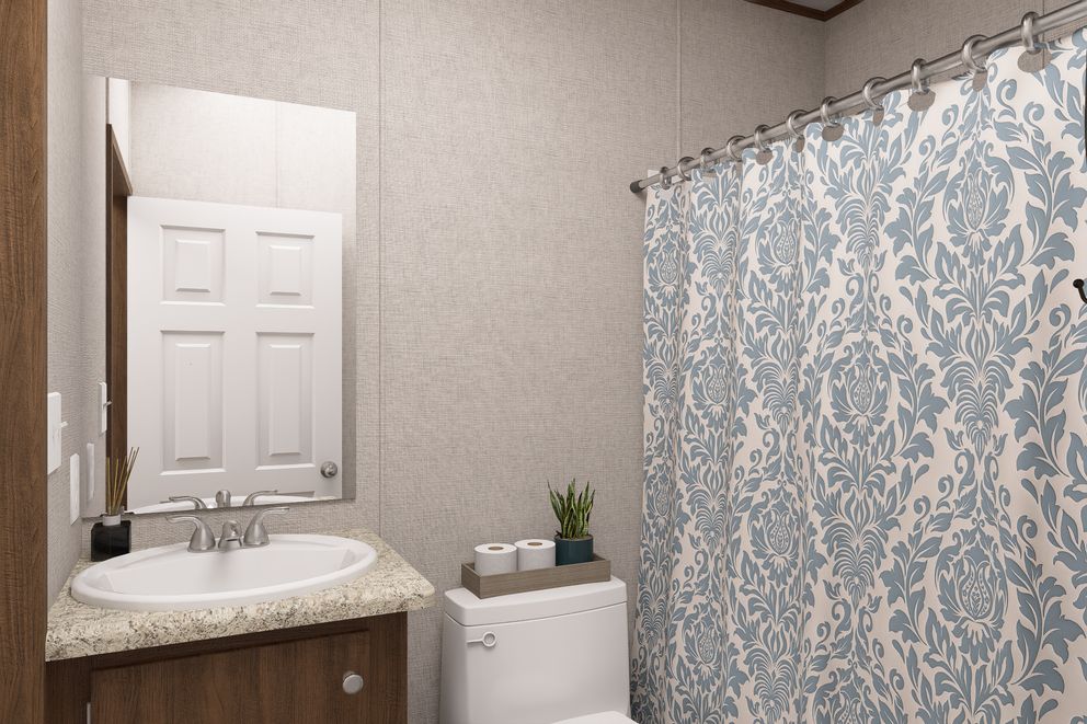 The CYPRESS Exterior. This Manufactured Mobile Home features 4 bedrooms and 2 baths.