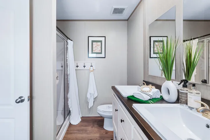 The ANNIVERSARY 16763I Primary Bathroom. This Manufactured Mobile Home features 3 bedrooms and 2 baths.